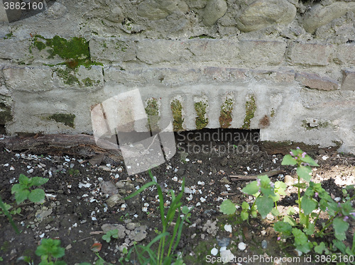 Image of Arch in a wall for irrigation