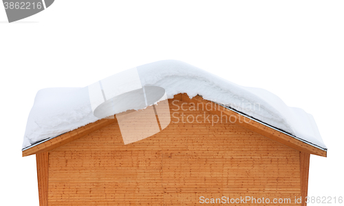 Image of Wooden house with snow on roof