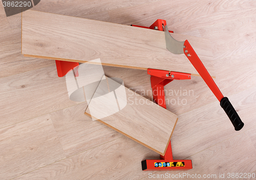 Image of Red tool for cutting laminate