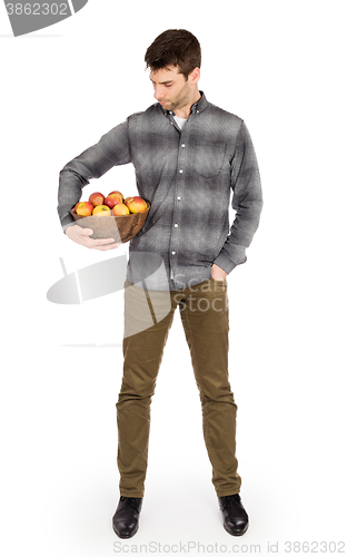 Image of Healthy man with bowl full of apples