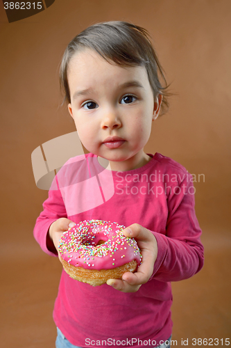 Image of Little girl with  donut