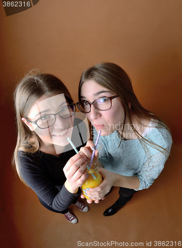 Image of Teen girls drinking together