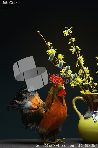 Image of rooster with vase