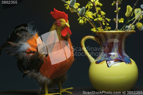 Image of rooster with vase
