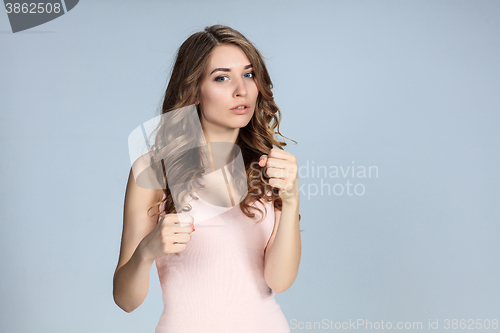 Image of young woman in fighting stance