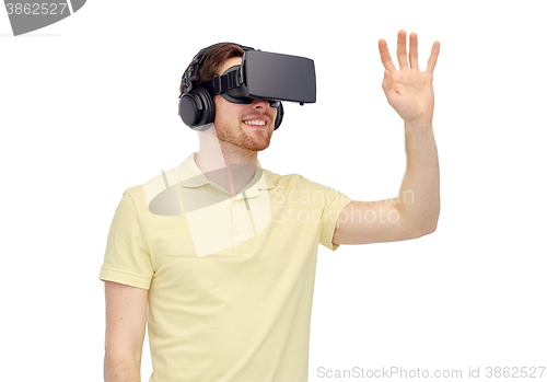 Image of happy man in virtual reality headset or 3d glasses