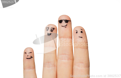 Image of close up of hands and fingers with smiley faces