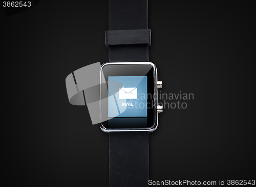 Image of close up of smart watch with e-mail message icon