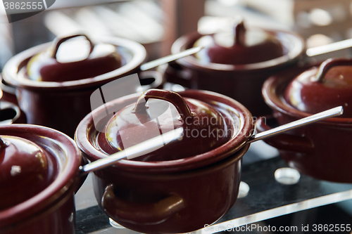 Image of close up of hot food pots at restaurant