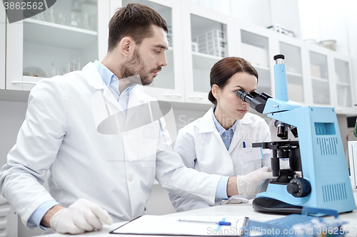 Image of young scientists making test or research in lab