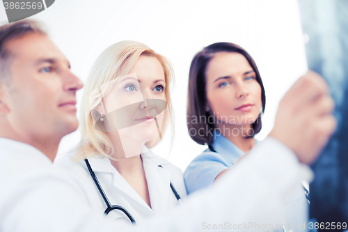 Image of doctors looking at x-ray