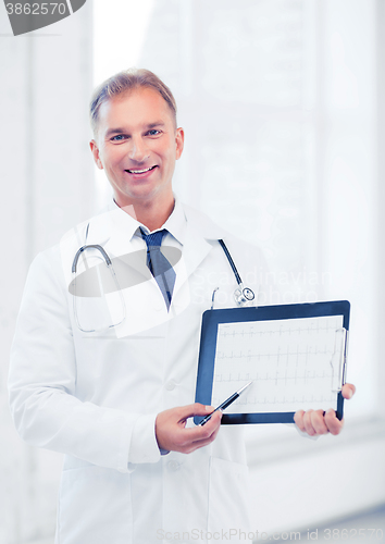 Image of male doctor with stethoscope showing cardiogram