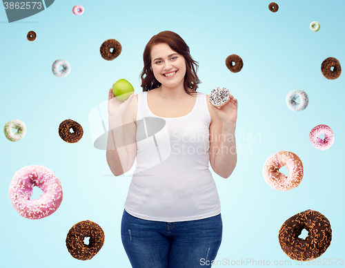 Image of happy plus size woman choosing apple or cookie