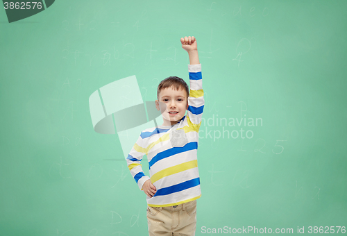 Image of happy smiling little boy with raised hand