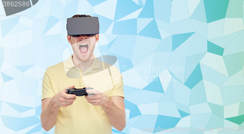 Image of angry man in virtual reality headset with gamepad