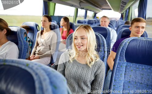 Image of group of passengers or tourists in travel bus