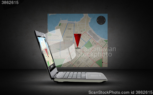 Image of laptop computer with gps navigator map on screen