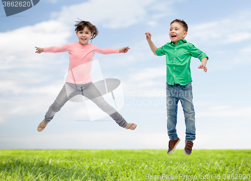 Image of happy little girl jumping in air