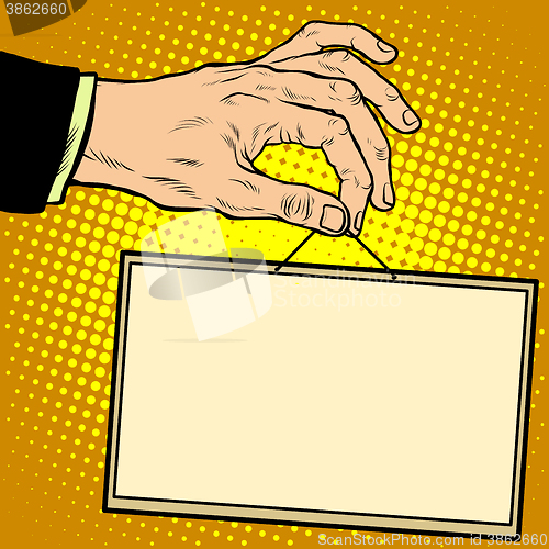 Image of Hand holding a sign