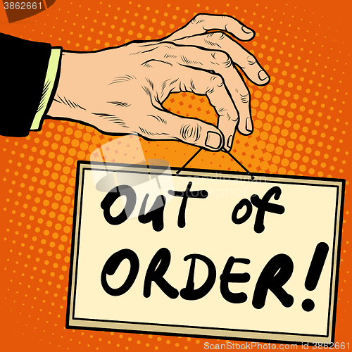 Image of Hand holding a sign out of order