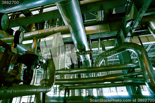 Image of Equipment, cables and piping as found inside of a modern industr