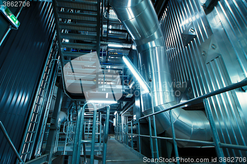 Image of Equipment, cables and piping as found inside of a modern industr