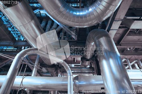 Image of Equipment, cables and piping as found inside of a modern industr