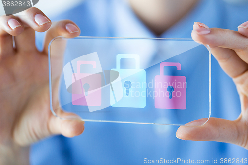 Image of close up of woman with transparent smartphone