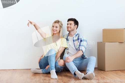 Image of couple with boxes moving to new home and dreaming