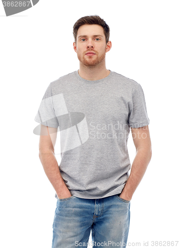 Image of young man in gray t-shirt and jeans