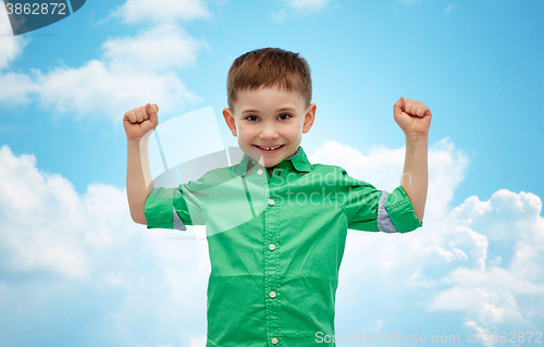 Image of happy smiling little boy with raised hand