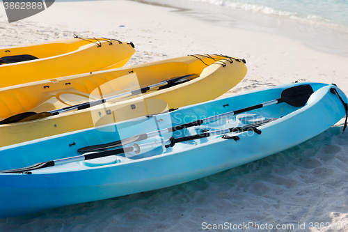 Image of canoes or kayaks on sandy beach
