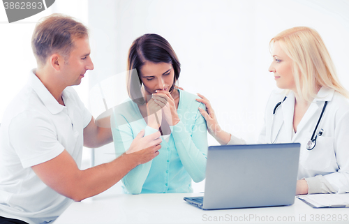 Image of doctor with patients in hospital