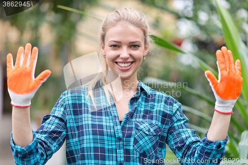 Image of happy female gardener