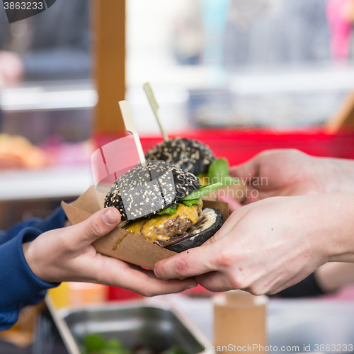 Image of Beef burgers being served on street food stall