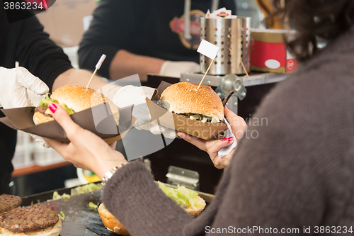 Image of Beef burgers being served on street food stall