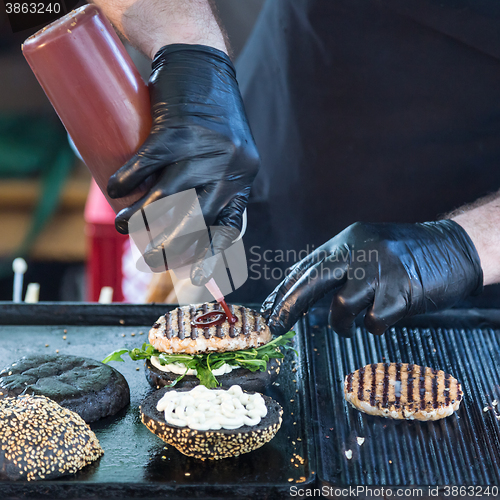 Image of Beef burgers ready to serve on food stall.