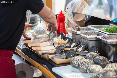 Image of Burgers ready to serve on food stall.