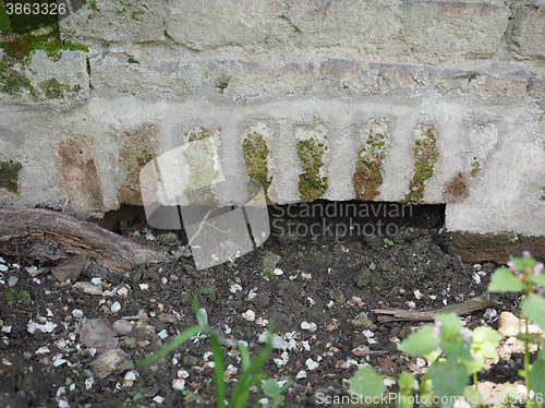 Image of Arch in a wall for irrigation