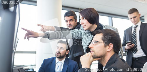 Image of Business team working in corporate office.