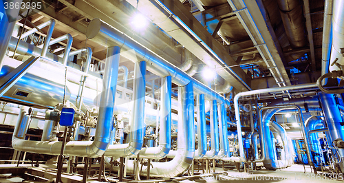 Image of Equipment, cables and piping as found inside of a modern industr