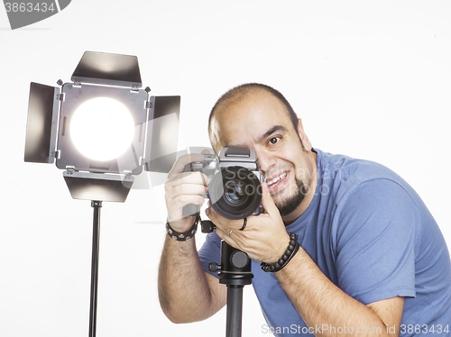 Image of professional photographer with photographic equipment