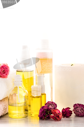 Image of Spa setting with pink roses and aroma oil, vintage style 