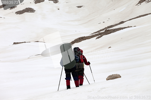 Image of Two hikers on snowy plateau
