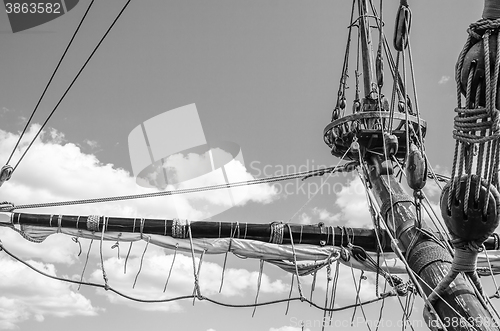 Image of Mast with sails of an old sailing vessel, black and white photo