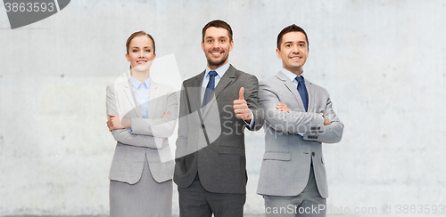 Image of happy business team showing thumbs up