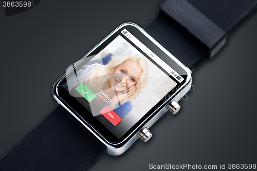 Image of close up of black smart watch with incoming call