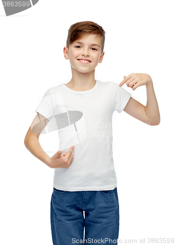 Image of happy boy pointing finger to his white t-shirt