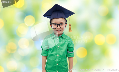Image of happy boy in bachelor hat or mortarboard