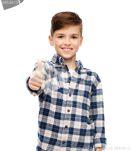 Image of smiling boy in checkered shirt showing thumbs up